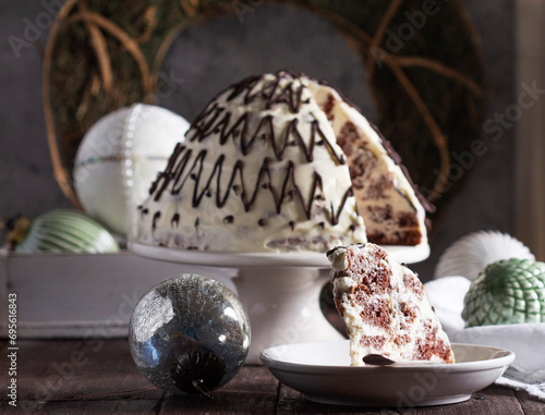 Obraz na płótnie Pancho cake made of chocolate biscuit with sour cream and pineapple in New Year's or Christmas decoration. Rustic style. w salonie