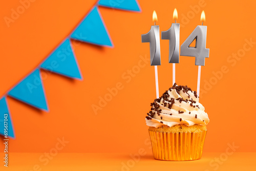 Candle number 114 - Cake birthday in orange background