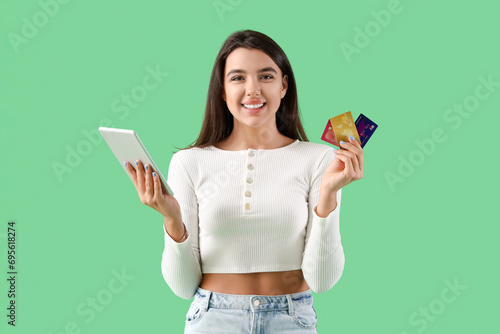Smiling young woman holding...