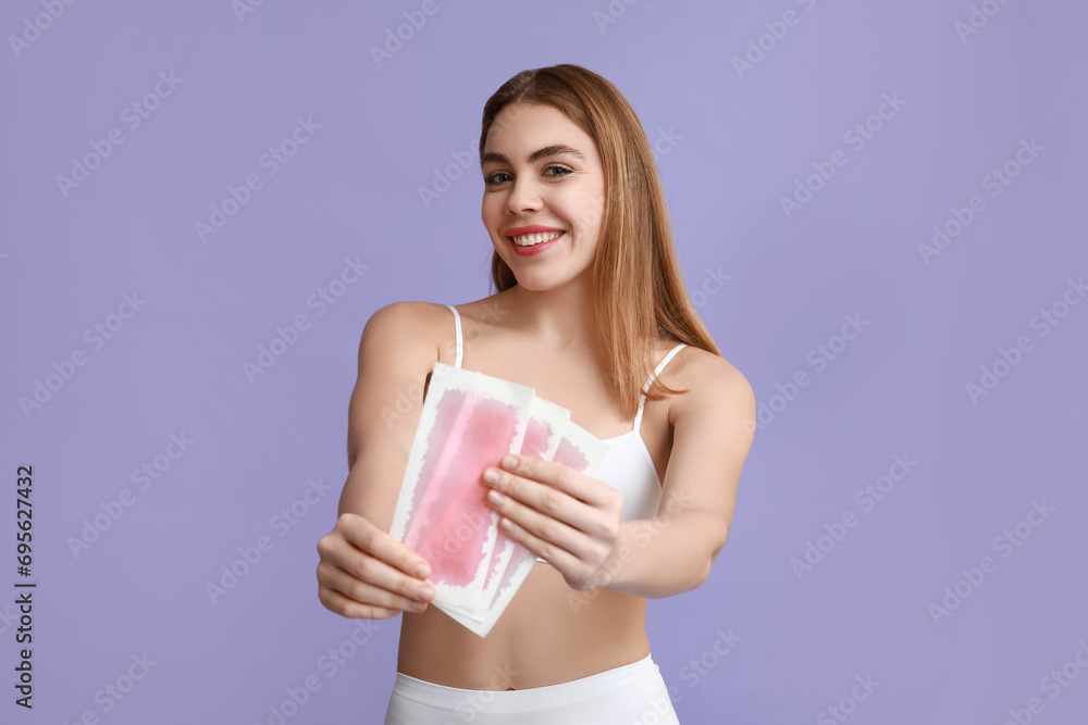 Beautiful young happy woman with wax strips on purple background Beautiful young happy woman with wax strips on purple background