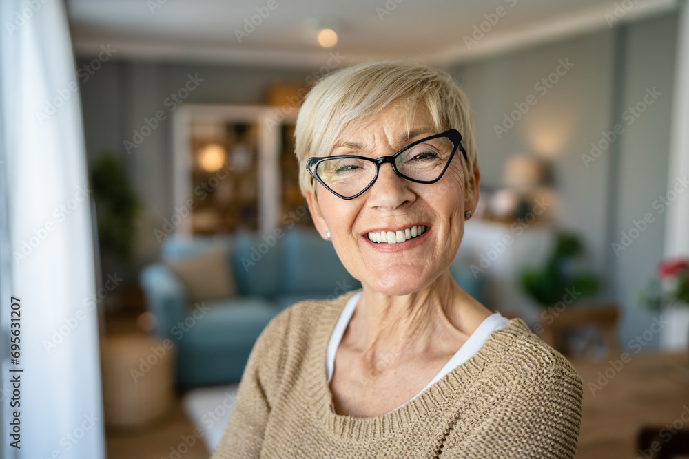 Close up portrait of one senior woman with short hair happy smile Close up portrait of one senior woman with short hair happy smile