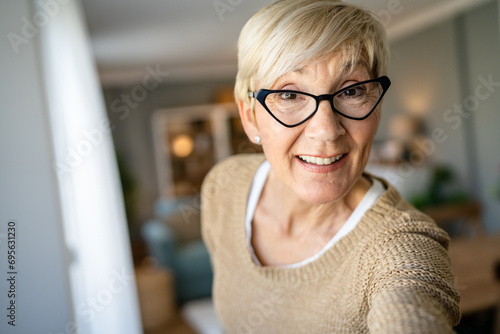 Close up portrait of one senior woman with short hair happy smile