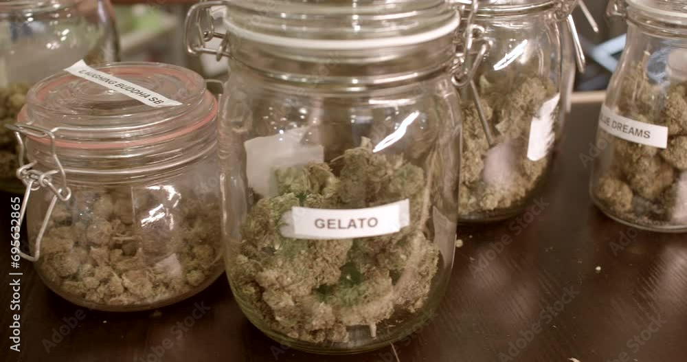 Close-up pack of dried cannabis flowers for recreational use. Legality of medicinal marijuana sales varies across regions and countries. Close-up pack of dried cannabis flowers for recreational use. Legality of medicinal marijuana sales varies across regions and countries.