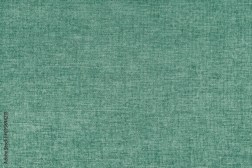 Textile background, green coarse fabric texture, cloth structure, jacquard woven upholstery