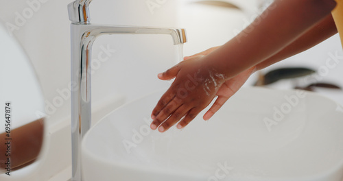 Fotografija Child, tap and washing hands in water for hygiene, cleaning or bacteria or germ removal in sink at home