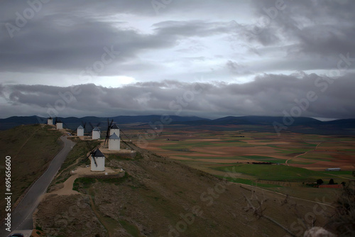 windmills in the mountain of spain with field background