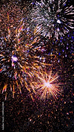 fireworks in the night sky. Vertical design in 9:16 ratio for smartphone and social media