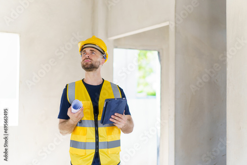 Senior professional caucasian white male real estate foreman inspecting inside the building construction, foreman checking the under construction building. Caucasian male engineer inspects interior.