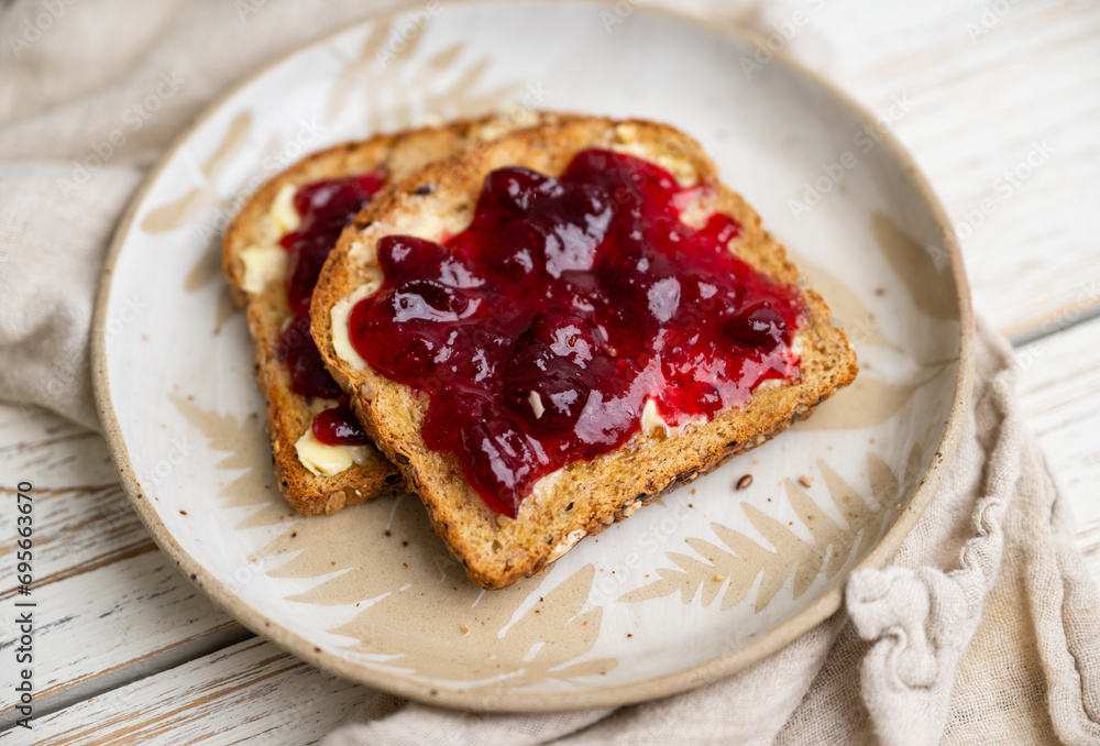Whole Grain Toast with Cranberry Jam on Top Whole Grain Toast with Cranberry Jam on Top