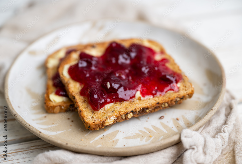 Whole Grain Toast with Cranberry Jam on Top Whole Grain Toast with Cranberry Jam on Top