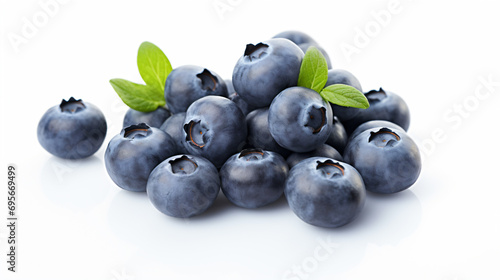 a pile of blueberries with leaves on top photo