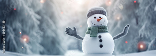 Christmas winter background with snowman in snow and blurred bokeh golden light background.Merry Christmas and happy new year greeting card with copy space, horizontal © ribelco