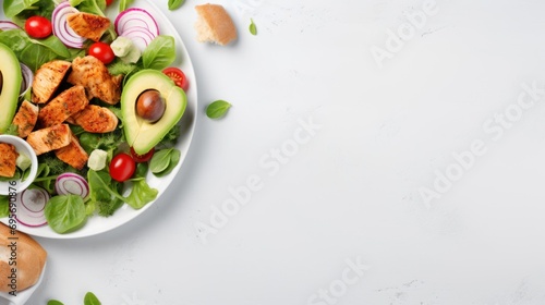 Delicious salad with chicken, avocado and vegetables served on table, 