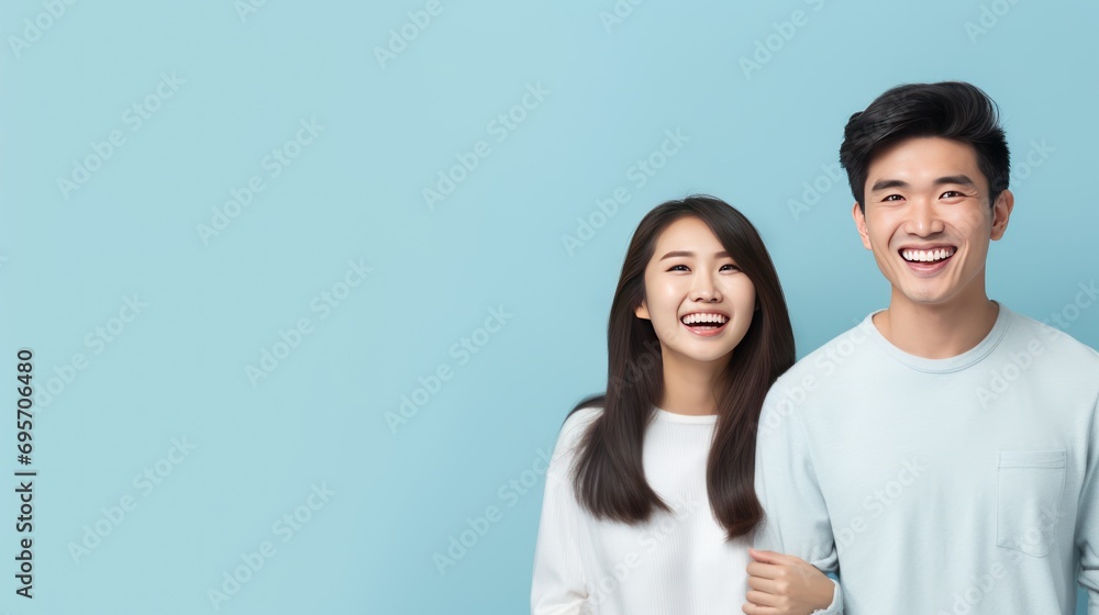 Young casual happy Asian man and woman o Young casual happy Asian man and woman o