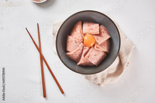 Obraz na plátně a bowl of deliciously cooked ham and egg yolk