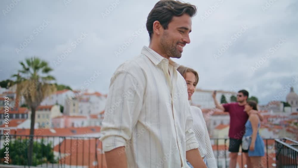 Romantic newlyweds walking terrace with cityscape closeup. Happy pair laughing Romantic newlyweds walking terrace with cityscape closeup. Happy pair laughing