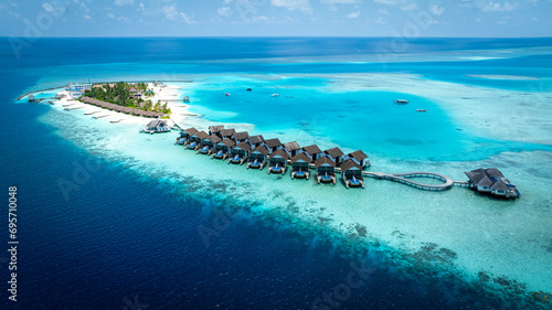 The Tropical aerial view with maldives paradise scenery seascape with water villas as amazing sea and lagoon beach, Exotic tourism