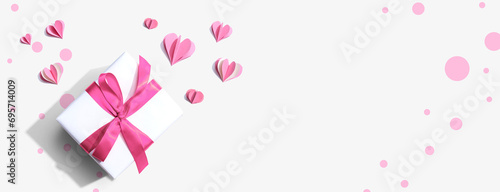 Valentines day or Appreciation theme with a gift box and paper craft hearts © Tierney