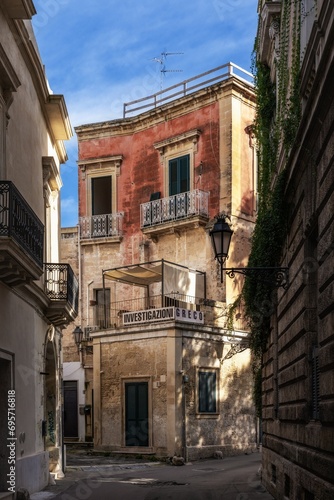 narrow alley with colourful shabby chic buildings in the old city center of Lecce © makasana photo