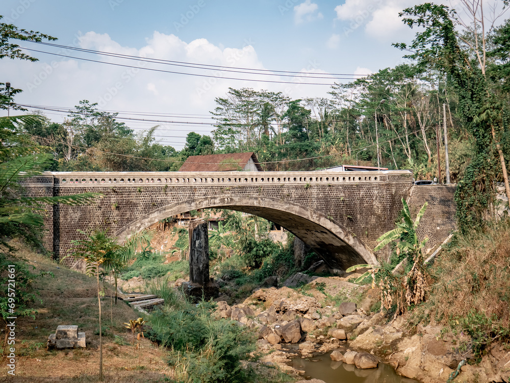 Fototapeta premium An ancient Dutch-made bridge in a residential area in the village