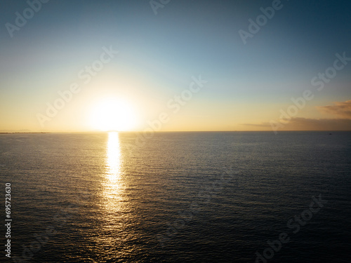 Fototapeta Naklejka Na Ścianę i Meble -  Aerial view of beautiful sea wave and sunrise sky