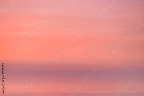 A beautiful sky tinted by the sun leaving vibrant shades of gold, pink, blue and multicolored. Clouds in the twilight evening and morning sky. Image of a cloudy sky in the evening and during the day