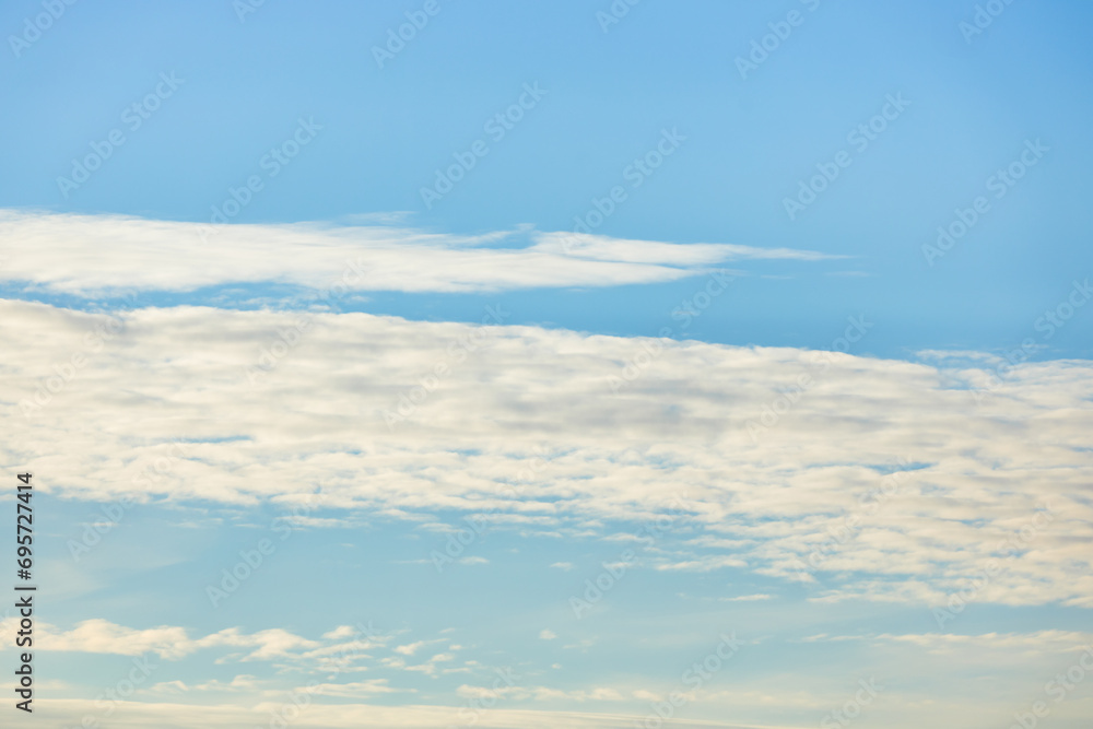 A beautiful sky tinted by the sun leaving vibrant shades of gold, pink, blue and multicolored. Clouds in the twilight evening and morning sky. Image of a cloudy sky in the evening and during the day A beautiful sky tinted by the sun leaving vibrant shades of gold, pink, blue and multicolored. Clouds in the twilight evening and morning sky. Image of a cloudy sky in the evening and during the day