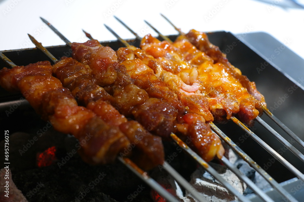 Grill lamb or beef on a skewer and eat it.