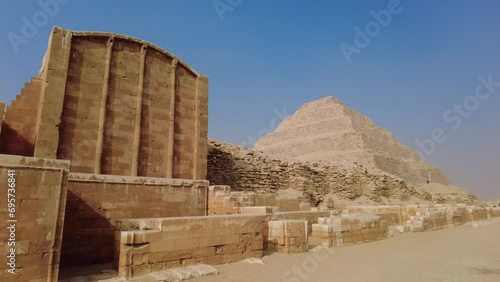 Saqqara, Egypt: Exterior view of the famous Djoser step pyramid in the Sakkara necropolis near Cairo in Egypt is the oldest large pyramid dating to 4500 years.  photo
