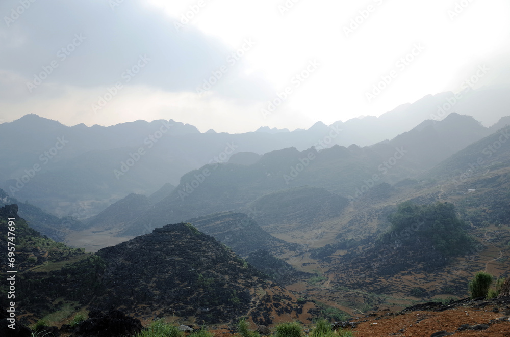 Ha Giang Province, Vietnam - March 8, 2016:
An image of the majestic and overlapping peaks of Ha Giang province, Vietnam Ha Giang Province, Vietnam - March 8, 2016:
An image of the majestic and overlapping peaks of Ha Giang province, Vietnam