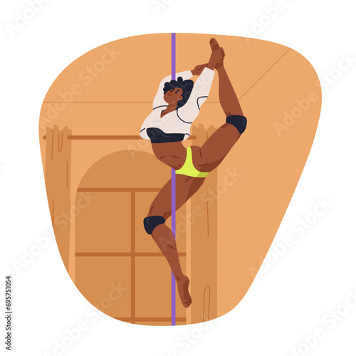 Pole dancer performing dance move, gripping bar with leg. Girl training advan...