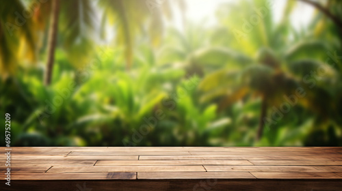 Wooden table top on blur tropical forest background.