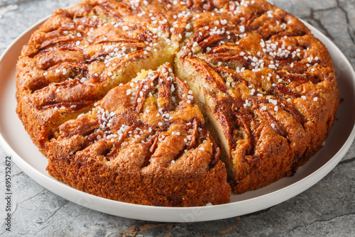 Apple cinnamon cake traditional Scandinavian autumn pie on a plate close-up on the table. Horizontal photo