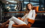 young and beautiful businesswoman sitting on arm chair