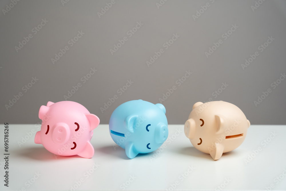 The piggy banks lie in agony. Financial crisis, end of savings, bankruptcy. Refinancing restructuring of debts. Economic depression. Depletion of savings and financial resources. Exorbitant expenses. The piggy banks lie in agony. Financial crisis, end of savings, bankruptcy. Refinancing restructuring of debts. Economic depression. Depletion of savings and financial resources. Exorbitant expenses.