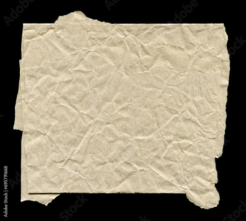 Crumpled sheet of paper on a black background. Design element