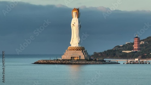 Aerial footage of Guanyin statue at seaside in nanshan temple, hainan island , China photo