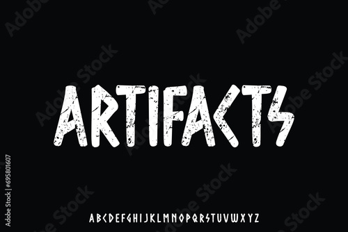 Decorative artifacts alphabet display font vector with grunge textured