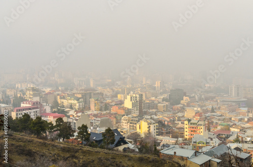 Vake and Vera neighborhoods covered with fog scenic view from Mtatsminda mountain (Tbilisi, Georgia) 