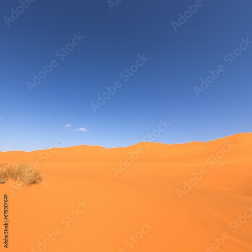 Blue sky with sand dune in desert.