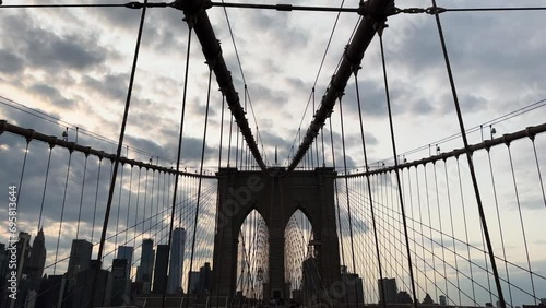 Sunset walk on Brooklyn Bridge in New York City, United States