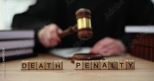 Words of death penalty from te cubes and judge knocks with gavel. Death penalty in world practice photo