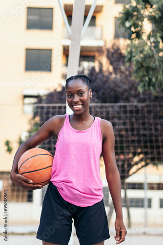 Portrait of Female Basketball Player Holding Ball