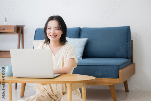 Young woman using a computer at a bing looking at the camera