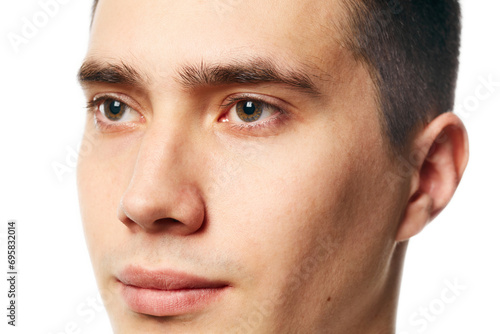 Cropped close up portrait of young man with well kept, shaved, well-groomed skin against white background. Concept of beauty treatment and hygiene, body care, anti-aging procedures.