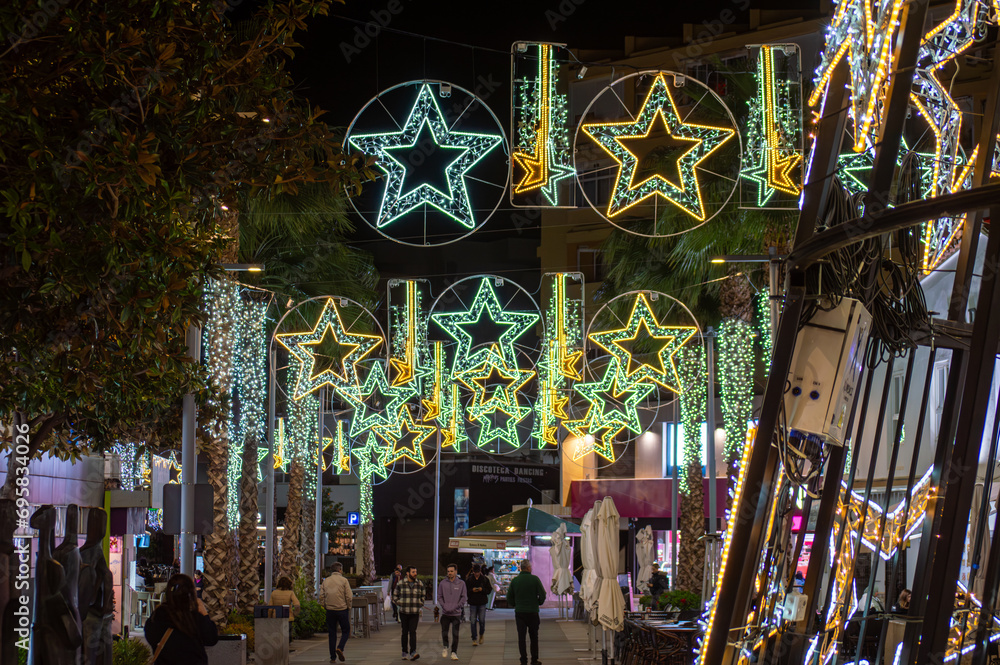Naklejka premium Capture the festive charm of the Christmas lights and tree in Torremolinos, Spain