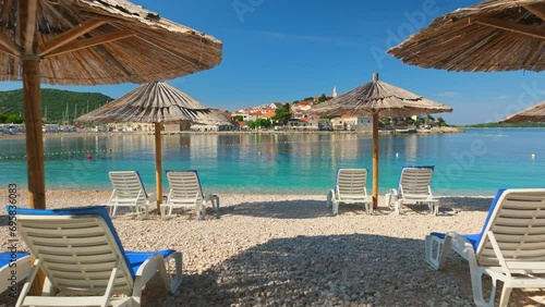 Idyllic beach near the charming Primosten town, Adriatic Sea in Croatia photo