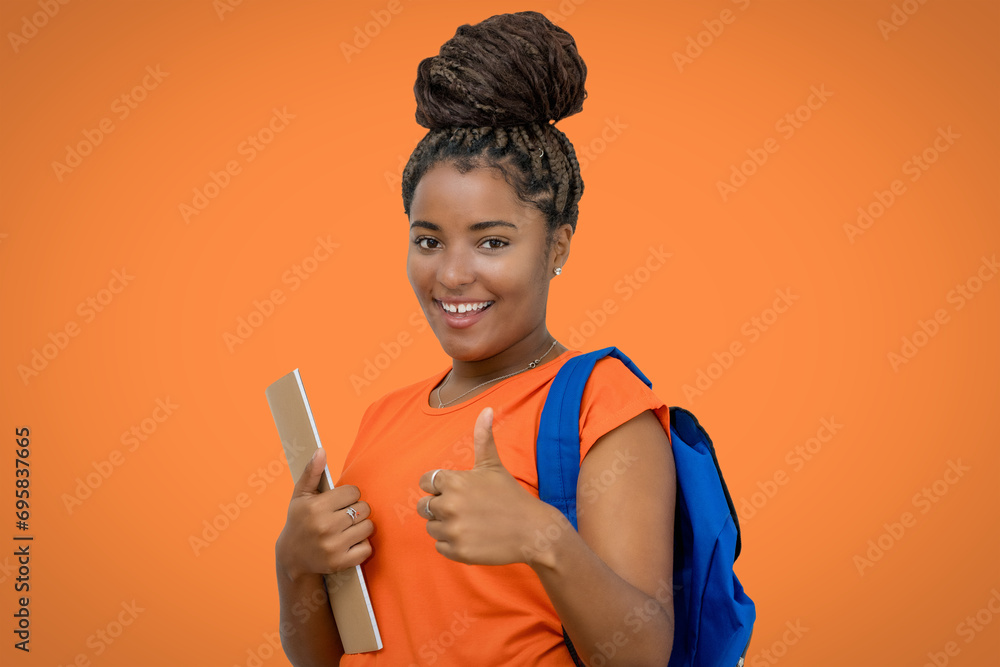 African american female student with backpack and paperwork showing thumb up African american female student with backpack and paperwork showing thumb up