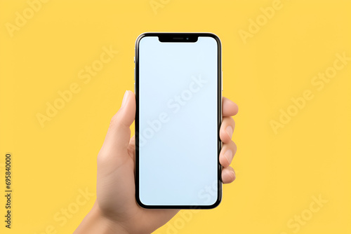 iPhone 15 Pro Max Studio Shot  Clipping Path  Blank Screen for Global Business Infographic on yellow background  Hand holding a smartphone.