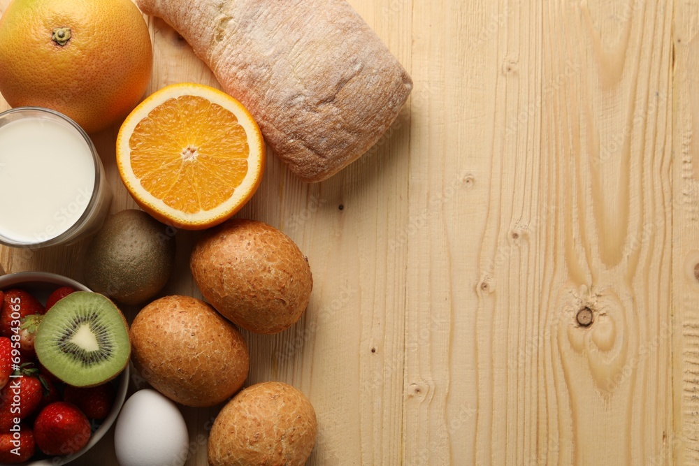 Allergenic food. Different fresh products on wooden table, flat lay and space for text Allergenic food. Different fresh products on wooden table, flat lay and space for text